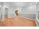 Dining room features wood floors, two-tone walls, and access to the kitchen at 395 Lake Swan Ct, Hiram, GA 30141