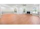Open-concept living room boasts natural light, fireplace and view into dining room at 395 Lake Swan Ct, Hiram, GA 30141