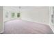 Expansive main bedroom with trey ceilings, neutral carpet and oversized windows at 395 Lake Swan Ct, Hiram, GA 30141