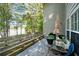 Relaxing patio area features a lake view and outdoor seating at 395 Lake Swan Ct, Hiram, GA 30141