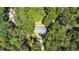 An aerial perspective highlights the home's secluded setting among lush, mature trees at 1165 E Beechwood Nw Dr, Atlanta, GA 30327