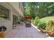 A beautiful back patio is decorated with planters, an umbrella, and seating for a relaxing outdoor space at 1165 E Beechwood Nw Dr, Atlanta, GA 30327