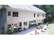 Exterior view of the home with a lovely stone patio for relaxation and entertainment at 1165 E Beechwood Nw Dr, Atlanta, GA 30327