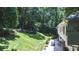 Spacious backyard features a lush lawn and a stone-tiled patio at 1165 E Beechwood Nw Dr, Atlanta, GA 30327