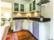 The bar area features display cabinets and dark countertops perfect for entertaining at 1165 E Beechwood Nw Dr, Atlanta, GA 30327