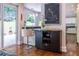 Wine bar area with granite countertop, wine rack, bar stool and outdoor view at 1165 E Beechwood Nw Dr, Atlanta, GA 30327
