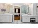 Bright bathroom with double vanity, vessel sinks, marble floors and a view to main bedroom at 1165 E Beechwood Nw Dr, Atlanta, GA 30327