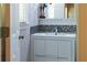 Stylish bathroom featuring a modern vanity and decorative mosaic tile accents at 1165 E Beechwood Nw Dr, Atlanta, GA 30327