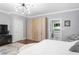 Beautiful bedroom featuring a sleek wardrobe, contemporary lighting, and stylish furnishings at 1165 E Beechwood Nw Dr, Atlanta, GA 30327