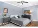 Charming bedroom featuring hardwood floors, ceiling fan, and a modern color palette at 1165 E Beechwood Nw Dr, Atlanta, GA 30327