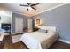 Light bedroom with hardwood floors, ceiling fan and desk area at 1165 E Beechwood Nw Dr, Atlanta, GA 30327