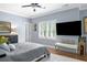 Cozy bedroom with hardwood floors, comfortable bed, and a large window at 1165 E Beechwood Nw Dr, Atlanta, GA 30327