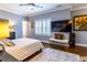 Bright bedroom with hardwood floors, a ceiling fan, and plantation shutters at 1165 E Beechwood Nw Dr, Atlanta, GA 30327