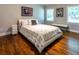 Bright bedroom with hardwood floors and natural light from two windows at 1165 E Beechwood Nw Dr, Atlanta, GA 30327