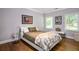 Comfortable bedroom with hardwood floors and a faux fur throw blanket at 1165 E Beechwood Nw Dr, Atlanta, GA 30327