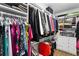 Organized walk-in closet features shelving, hanging rods, and ample storage space at 1165 E Beechwood Nw Dr, Atlanta, GA 30327