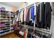 Well-appointed walk-in closet with custom shelving, hanging space, and shoe storage at 1165 E Beechwood Nw Dr, Atlanta, GA 30327