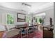 Formal dining room with modern lighting, a large wooden table, and seating for six at 1165 E Beechwood Nw Dr, Atlanta, GA 30327