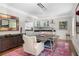 Elegant dining room featuring a modern chandelier, stylish furniture, and a vibrant colorful rug at 1165 E Beechwood Nw Dr, Atlanta, GA 30327