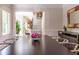 The dining area features a large table with seating, bright windows, and classic trim at 1165 E Beechwood Nw Dr, Atlanta, GA 30327