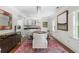 Bright dining room with a modern chandelier, stylish seating, and a colorful patterned rug at 1165 E Beechwood Nw Dr, Atlanta, GA 30327