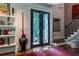 Elegant foyer with decorative double doors and a staircase with iron railings at 1165 E Beechwood Nw Dr, Atlanta, GA 30327