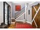 Elegant foyer features decorative glass front doors, hardwood floors, and staircase with iron railing at 1165 E Beechwood Nw Dr, Atlanta, GA 30327