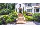 Beautiful stone stairway leading to the front entrance, surrounded by lovely landscaping at 1165 E Beechwood Nw Dr, Atlanta, GA 30327