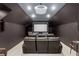 Spacious home theater featuring comfortable seating, projector and screen, perfect for movie nights at 1165 E Beechwood Nw Dr, Atlanta, GA 30327