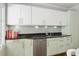 Kitchen featuring granite countertops, sleek appliances, and ample cabinet space for storage at 1165 E Beechwood Nw Dr, Atlanta, GA 30327
