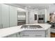 Kitchen featuring stainless steel appliances, a central island, and a gas cooktop with white countertop at 1165 E Beechwood Nw Dr, Atlanta, GA 30327