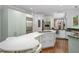 A kitchen with stainless steel appliances, a center island with a cooktop, and white countertops at 1165 E Beechwood Nw Dr, Atlanta, GA 30327