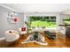 Open living area with glass doors to backyard, hardwood floors, and modern decor at 1165 E Beechwood Nw Dr, Atlanta, GA 30327