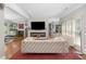Bright living room features a modern fireplace, neutral tones, and hardwood floors at 1165 E Beechwood Nw Dr, Atlanta, GA 30327