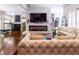 Beautiful living room with hardwood floors, fireplace, modern fixtures, and lots of natural light at 1165 E Beechwood Nw Dr, Atlanta, GA 30327