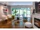 Bright living area with fireplace, hardwood floors and sliding glass doors to the backyard at 1165 E Beechwood Nw Dr, Atlanta, GA 30327