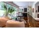 Bright, open-concept living area with access to outdoor patio, bar and kitchen at 1165 E Beechwood Nw Dr, Atlanta, GA 30327