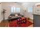 The cozy living area features a sofa, two windows, and stylish decor on a hardwood floor at 1165 E Beechwood Nw Dr, Atlanta, GA 30327