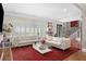 Bright living room features hardwood floors, shuttered windows, and neutral decor at 1165 E Beechwood Nw Dr, Atlanta, GA 30327