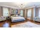 The main bedroom offers a spacious layout, large windows, and stylish furnishings with natural lighting at 1165 E Beechwood Nw Dr, Atlanta, GA 30327