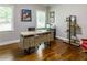 Functional home office with modern desk, shelving, and hardwood floors at 1165 E Beechwood Nw Dr, Atlanta, GA 30327