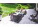 Relaxing patio with cozy seating and views of the private backyard at 1165 E Beechwood Nw Dr, Atlanta, GA 30327