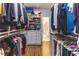 Spacious walk-in closet with custom shelving and drawers, offering ample storage solutions at 1165 E Beechwood Nw Dr, Atlanta, GA 30327