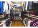 Well-organized walk-in closet with shelves and hanging rods for optimal storage at 1165 E Beechwood Nw Dr, Atlanta, GA 30327