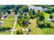 Aerial view of a property with trees near the water, showcasing its location and neighborhood amenities at 175 Heritage Farm Ln, Fayetteville, GA 30215