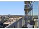 Relaxing condo balcony with chair overlooking the city skyline and tree line at 3324 Peachtree Rd # 2717, Atlanta, GA 30326