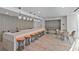 Bright bar area with pendant lighting, island seating, and casual dining tables at 3324 Peachtree Rd # 2717, Atlanta, GA 30326