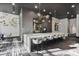 Stylish bar area with a long counter, pendant lighting, and ample seating at 3324 Peachtree Rd # 2717, Atlanta, GA 30326