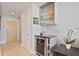 Hallway with bar area featuring wine cooler and glassware display at 3324 Peachtree Rd # 2717, Atlanta, GA 30326