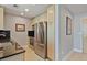 Efficient kitchen with stainless steel appliances and wood cabinets at 3324 Peachtree Rd # 2717, Atlanta, GA 30326